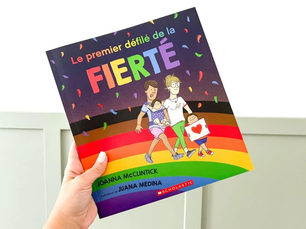 French pride book called Le premier défilé de la fierté to learn about the history of pride.